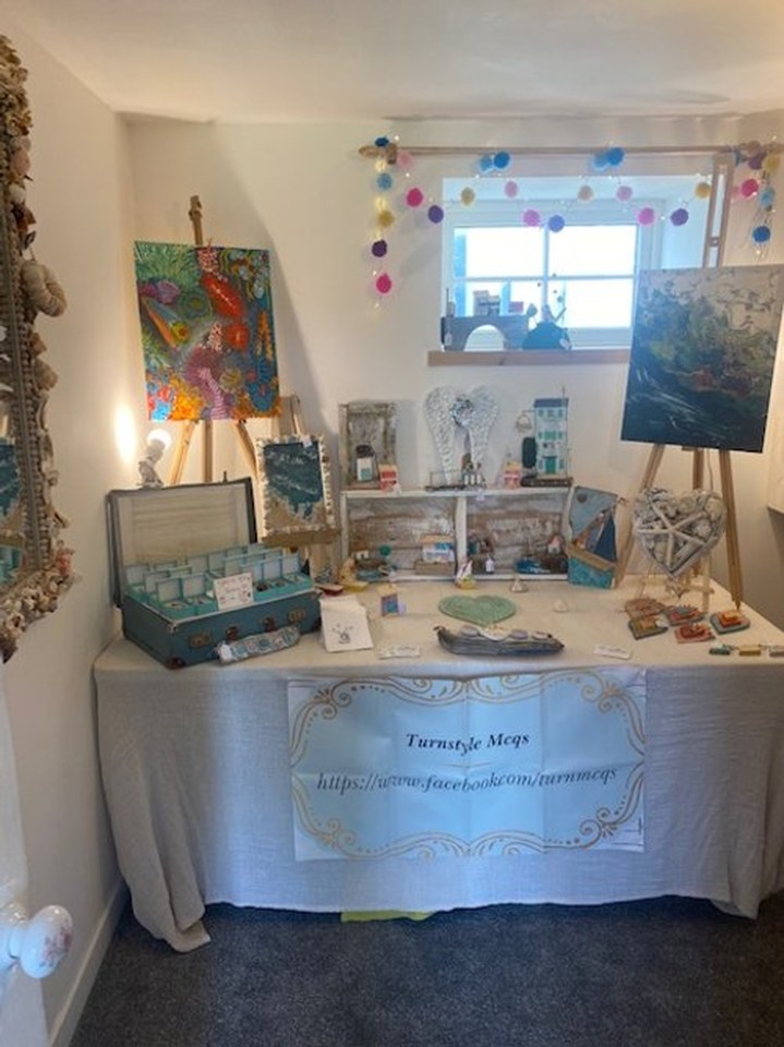 McQueenie displays and sells her artwork to visitors