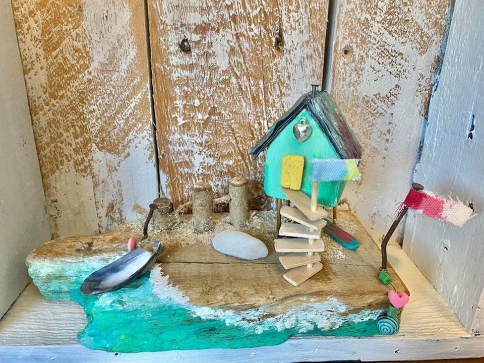 McQueenie's artworks include crystal necklaces, and driftwood houses