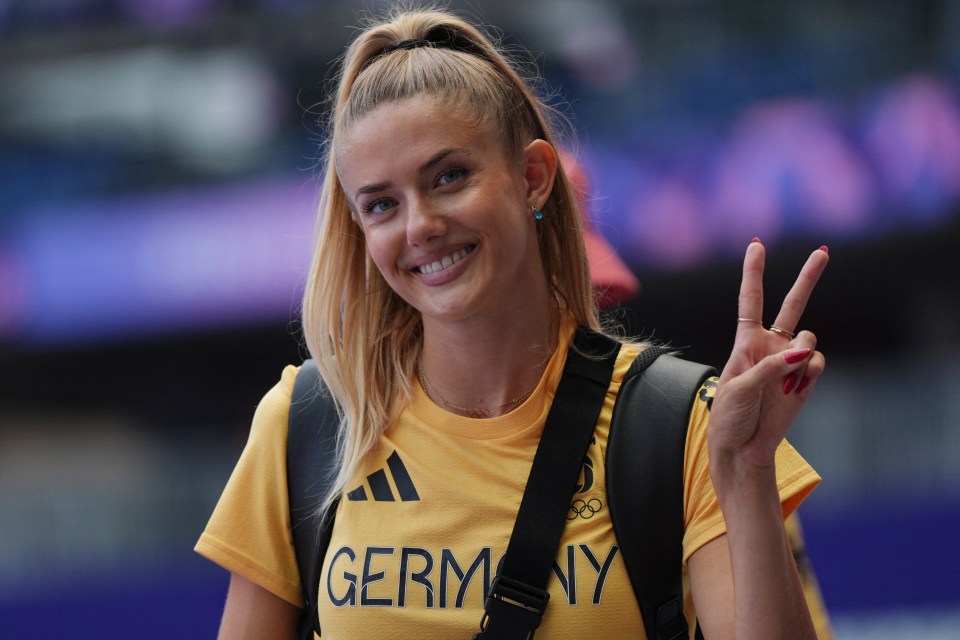 a woman wearing a yellow shirt that says germany on it