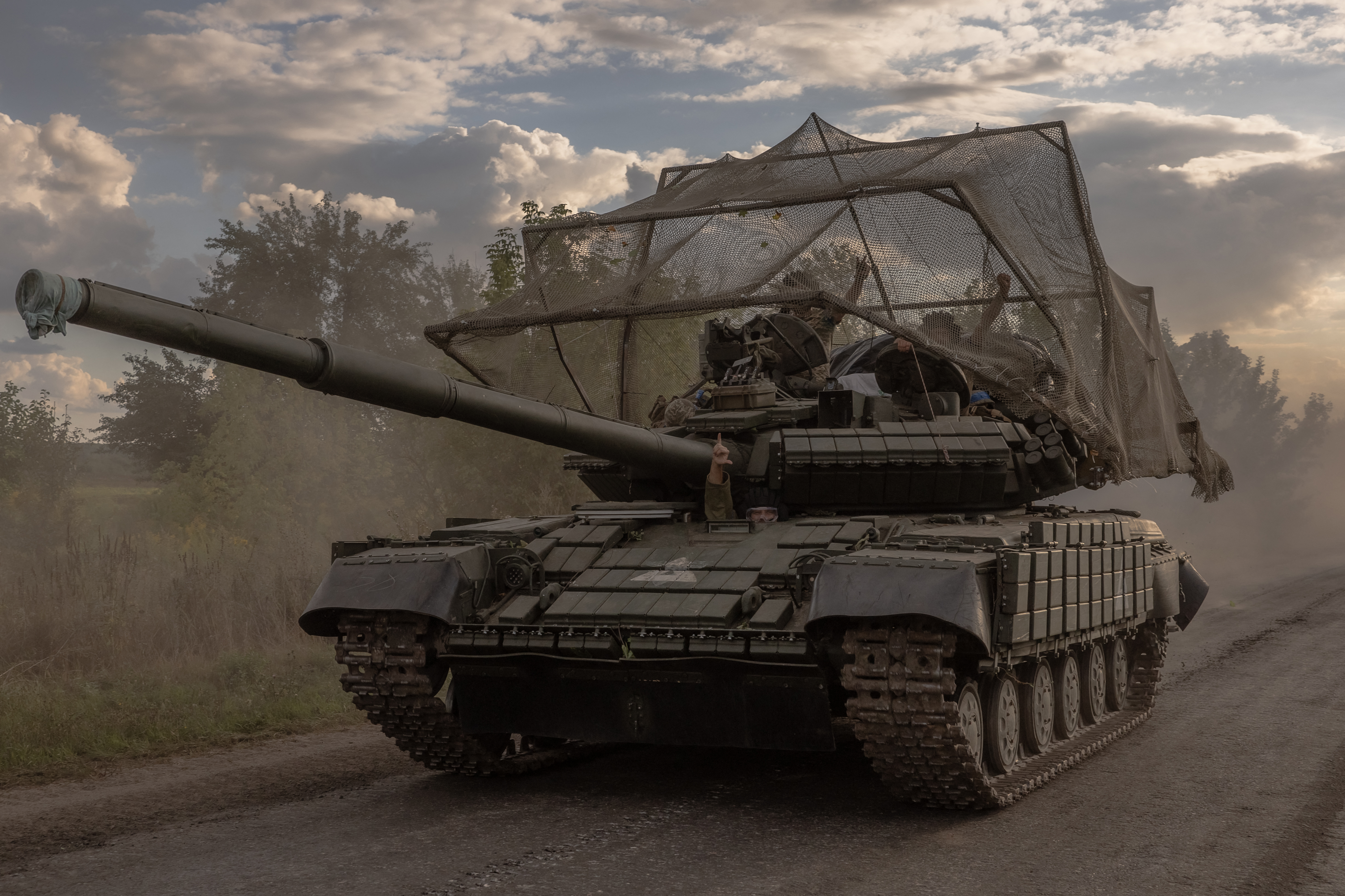 A Ukrainian tank storms into Kursk as they continue with their historical invasion of Russia's Kursk region