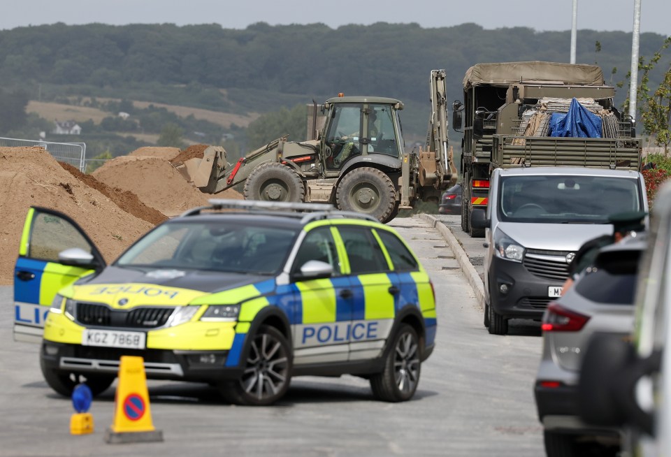 Army and police deal with a suspected World War Two bomb discovered on a building site