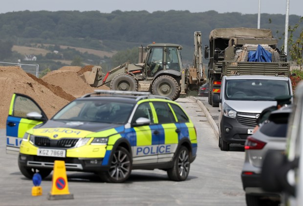 a police car is parked on the side of the road