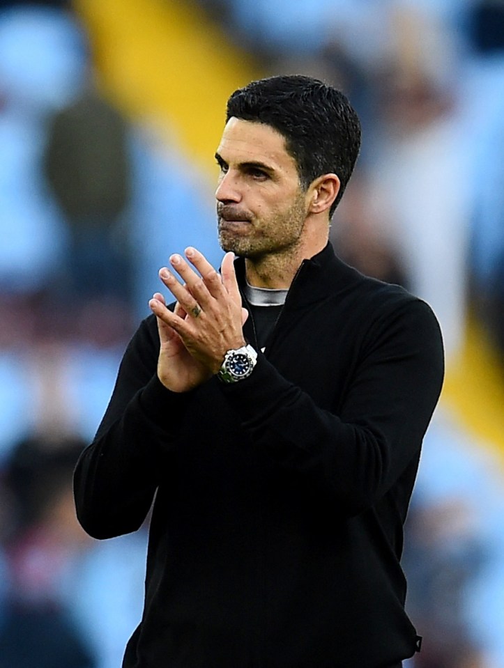 a man wearing a watch is clapping his hands