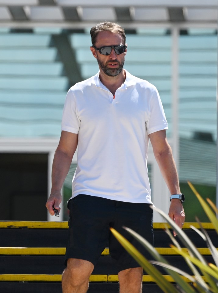 a man wearing sunglasses and a white polo shirt