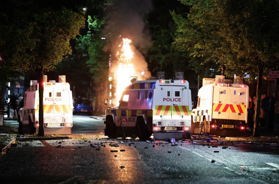 several police vehicles are parked on the side of the road