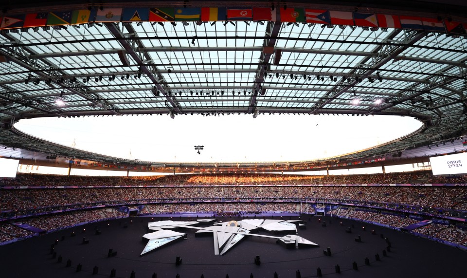 a large stadium with a sign that says paris 2024