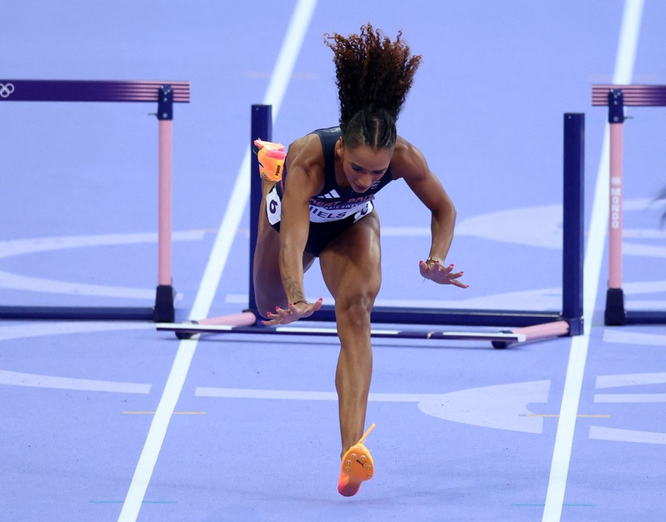 British athlete Lina Nielsen hits the floor after clipping the final hurdle