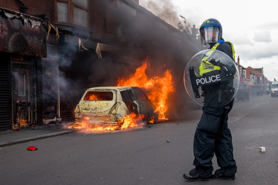 A car that was set alight by far-right activists holding a demonstration in Middlesbrough on August 04