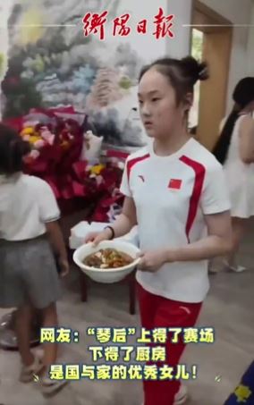 a young girl is holding a bowl of food in her hands .