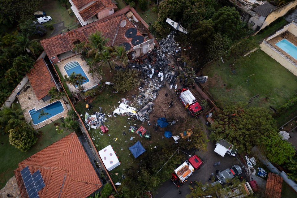 an aerial view of a house with a swimming pool