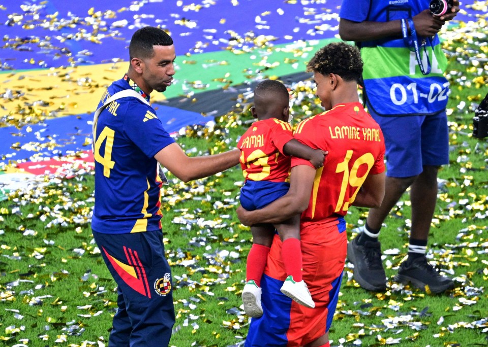 Yamal with his father Nasraoui and his younger brother as they celebrate winning the Euros