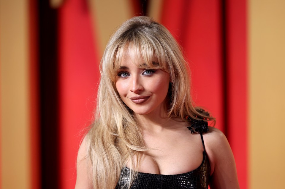 Sabrina Carpenter has a sweeping 80s-inspired fringe as part of her trademark style