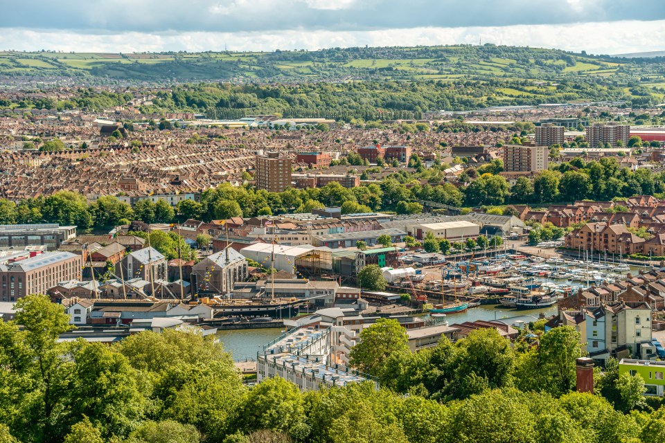 an aerial view of a city with a few buildings including one that says ' tesco ' on it