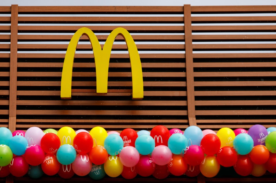 a bunch of balloons with mcdonald 's written on them