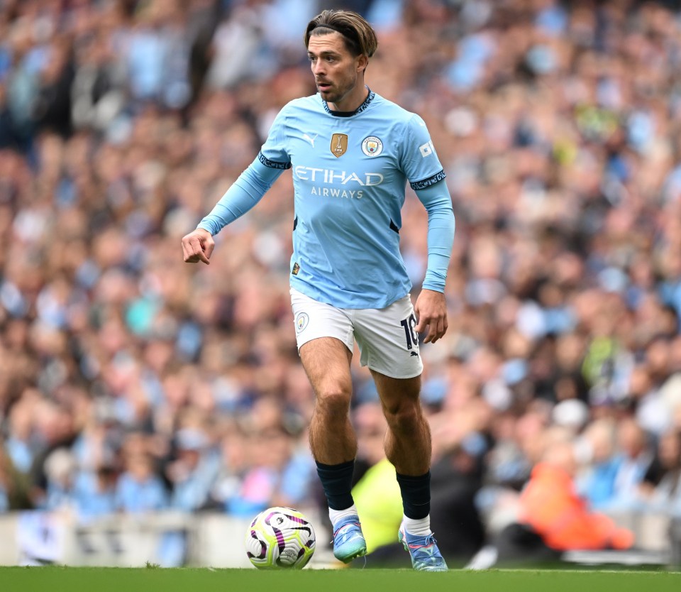 a soccer player with the word etihad on his jersey