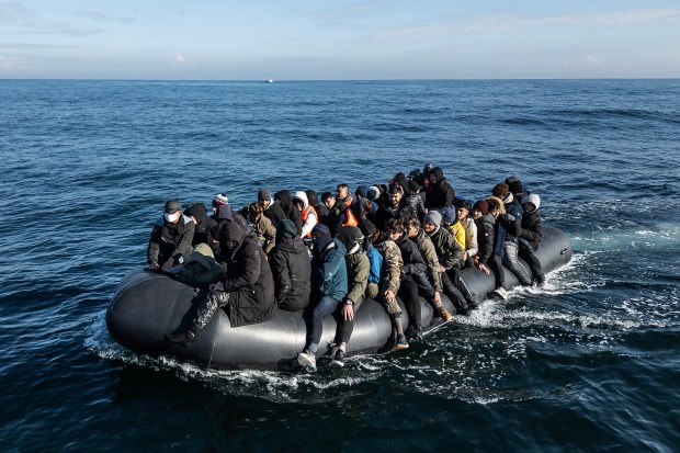 a large group of people in a raft in the ocean