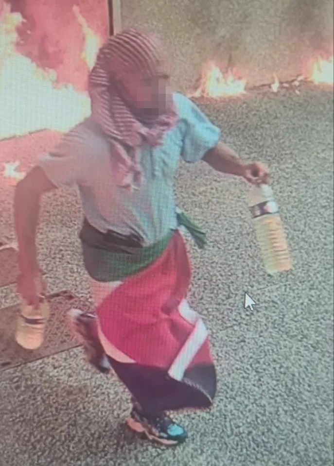 The potential suspect carrying two bottles and a Palestinian flag draped around his waist, leaving the scene in La Grande-Motte, southern France