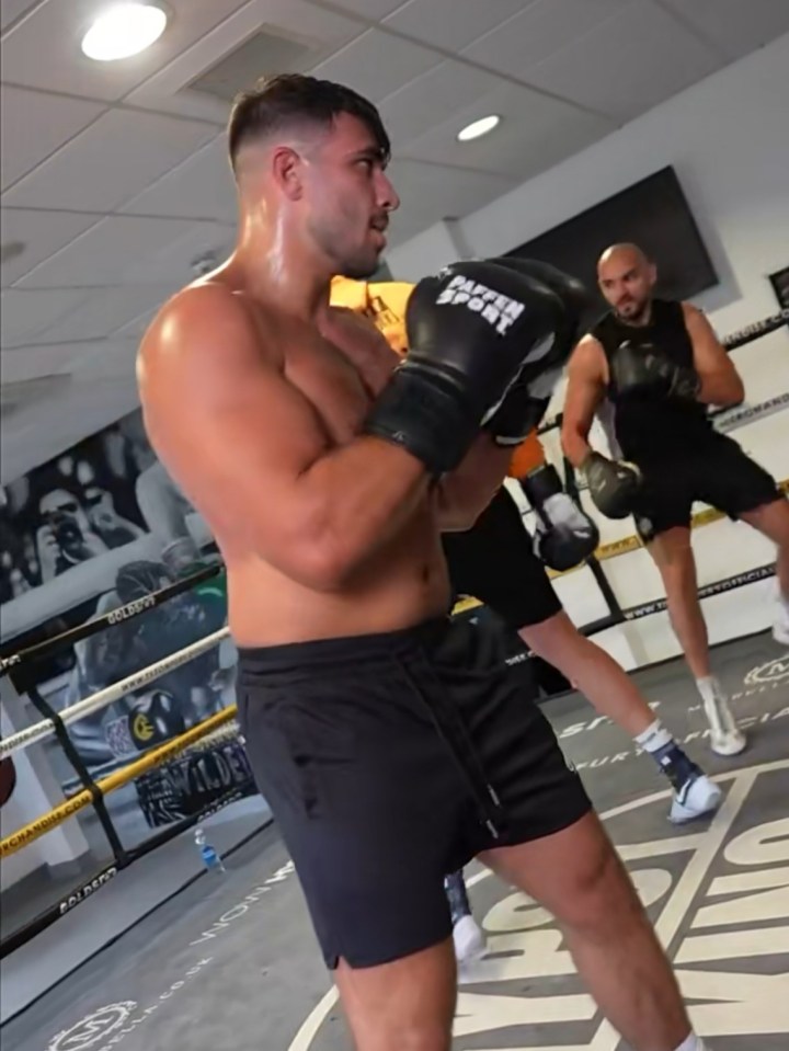 tommy fury is shown on a phone screen