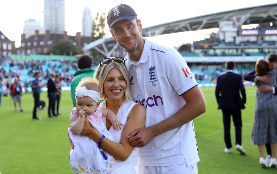 a man and woman holding a baby wearing a shirt that says rch