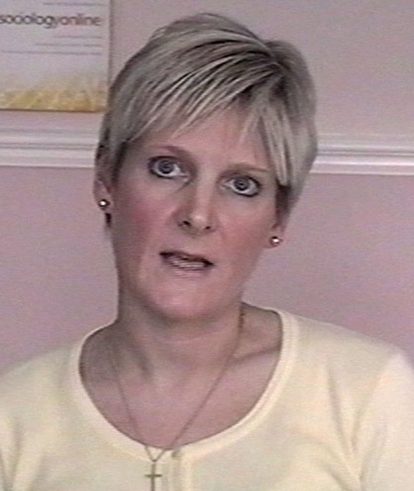 a woman sitting in front of a sign that says sociologyonline