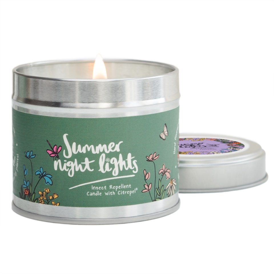 a candle in a tin that says summer night lights