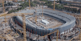 an aerial view of a large stadium under construction