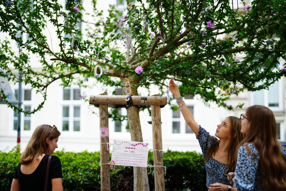 Fans of US mega-star Taylor Swift, so-called "Swifties", hang beaded bracelets on a "friendship bracelet tree" in Vienna, Austria, after her three scheduled concerts were cancelled following the arrest of an Islamic State sympathiser in connection with an attack plot. The Vienna leg of a tour by American mega-star Taylor Swift has been cancelled after Austria arrested an Islamic State sympathiser in connection with an attack plot, the organisers said on August 7, 2024. Authorities had earlier confirmed the arrest of a 19-year-old sympathiser of the armed group for allegedly planning an attack in the Vienna region, warning he had a "focus" on Swift's three upcoming shows. About 65,000 spectators were expected at each show scheduled for August 8, 9 and 10. (Photo by Eva MANHART / APA / AFP) / Austria OUT (Photo by EVA MANHART/APA/AFP via Getty Images)