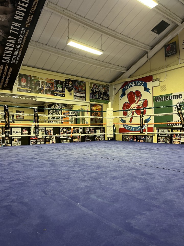 a boxing ring with a welcome sign on the wall