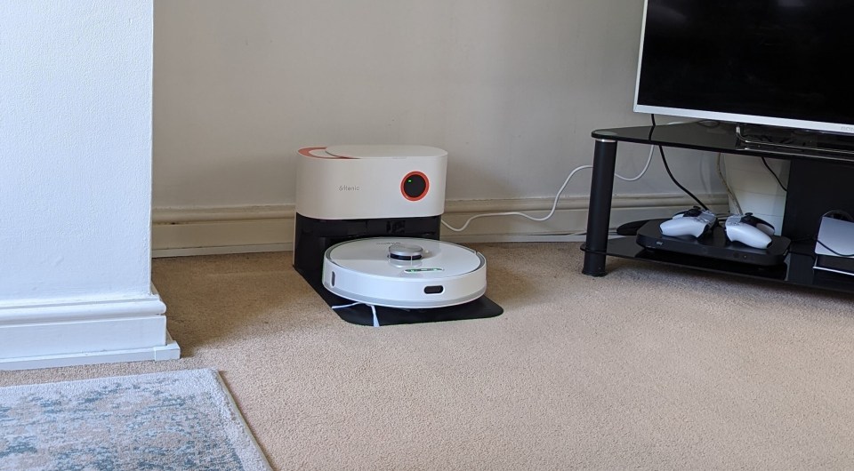 The Ultenic T10 Pro sitting in its docking station in our tester's living room