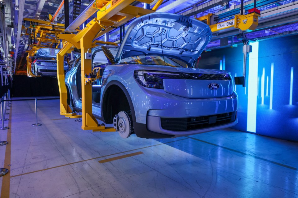 A fully electric Ford Explorer sports utility vehicle (SUV) on an assembly line during the opening ceremony of the Ford Motor Co. Cologne Electric Vehicle Center, following a $2 billion modernization program, in Cologne, Germany, on Monday, June 12, 2023. After years of falling market share in Europe, Ford plans to only manufacture EVs in the region by the end of the decade. Photographer: Alex Kraus/Bloomberg via Getty Images