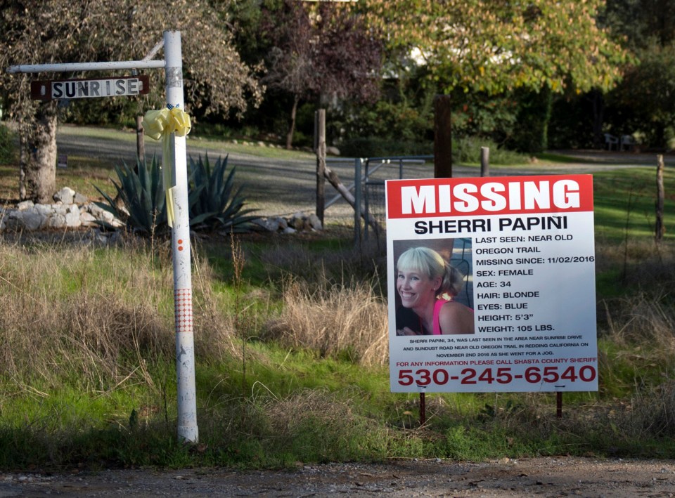 FILE - In this Nov. 10, 2016 file photo, a "missing" sign for Mountain Gate, Calif., resident Sherri Papini, 34, is placed along side Sunrise Drive, near the location where the mom of two is believed to have gone missing while on a afternoon jog. A Northern California sheriff has released new details in the mysterious disappearance Papani, found battered and bruised along a freeway after being missing for three weeks. The Shasta County sheriff's department said Wednesday, Oct. 25, 2017, that investigators collected male DNA from the clothing Papini was wearing when she was found Thanksgiving morning and female DNA that was discovered on Papini's body. The samples have not been identified. (Andrew Seng/The Sacramento Bee via AP, File)