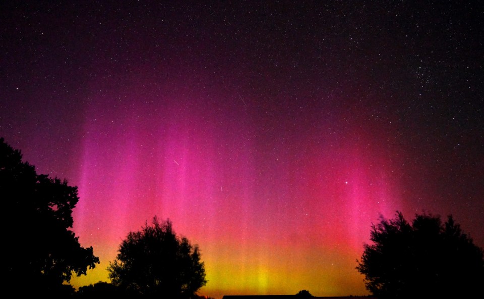 the aurora borealis shines brightly in the night sky