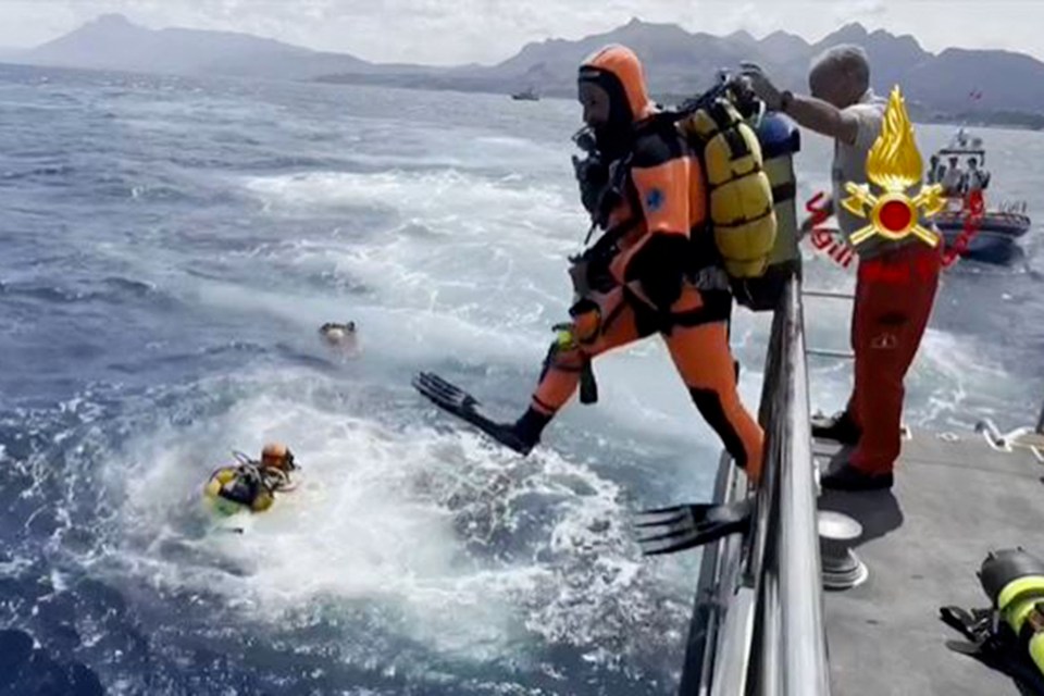 This photo taken and handout on August 19, 2024, by the Vigili del Fuoco, the Italian Corps. of Firefighters, shows divers off Porticello on the site where the British-flagged luxury yacht Bayesian sank with 22 people onboard. Specialist divers launched a fresh search for six people, including UK tech tycoon Mike Lynch and the chairman of Morgan Stanley International, missing since their yacht capsized off the Italian island of Sicily. The Bayesian, which had 22 people aboard including 10 crew, was anchored some 700 metres from port before dawn when it was struck by a waterspout, a sort of mini tornado. Fifteen people aboard, including a mother with a one-year-old baby, were plucked to safety; one man has been found dead; and six people remain missing. (Photo by Handout / Vigili del Fuoco / AFP) / RESTRICTED TO EDITORIAL USE - MANDATORY CREDIT "AFP PHOTO / VIGILI DEL FUOCO / HANDOUT" - NO MARKETING NO ADVERTISING CAMPAIGNS - DISTRIBUTED AS A SERVICE TO CLIENTS (Photo by HANDOUT/Vigili del Fuoco/AFP via Getty Images)