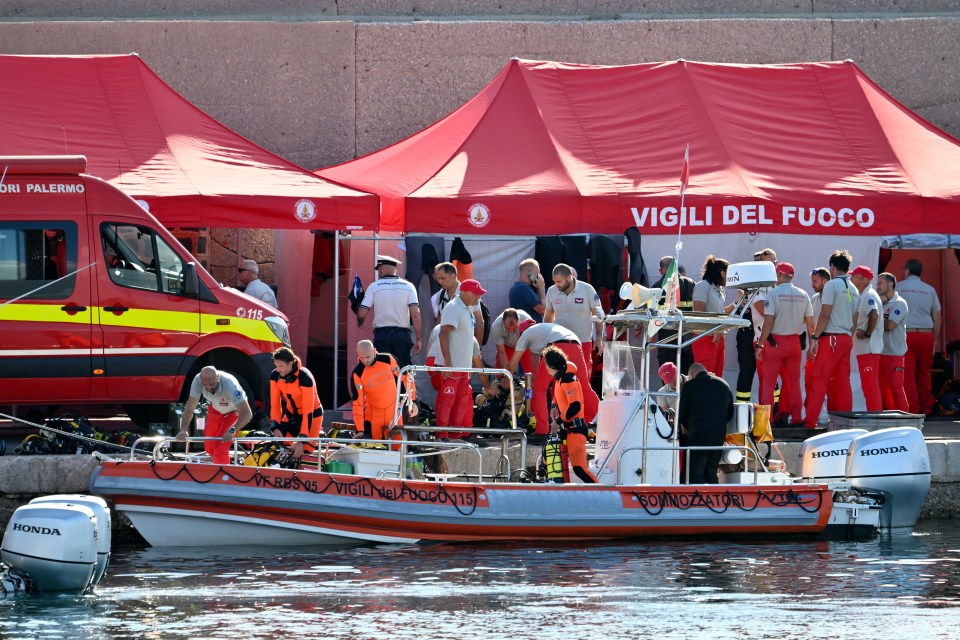 Divers of the Vigili del Fuoco, the Italian Corps. of Firefighters, get ready in Porticello near Palermo, on August 21, 2024 two days after the British-flagged luxury yacht Bayesian sank. Rescuers with divers and an underwater drone search for six people believed trapped when the boat sank. Among the six missing were UK tech entrepreneur Mike Lynch and his 18-year-old daughter Hannah, and Jonathan Bloomer, the chair of Morgan Stanley International, and his wife Judy. The Bayesian, which had 22 people aboard including 10 crew, was anchored some 700 metres from port before dawn when it was struck by a waterspout, a sort of mini tornado. Fifteen people aboard, including a mother with a one-year-old baby, were plucked to safety; one man has been found dead; and six people remain missing. (Photo by Alberto PIZZOLI / AFP) (Photo by ALBERTO PIZZOLI/AFP via Getty Images)