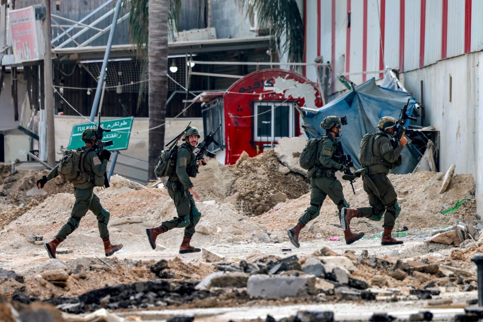 Israeli soldiers take position during an army operation in Tulkarm in the north of the occupied West Bank on August 29, 2024. Israel on August 28 launched a large-scale operation in the occupied West Bank where the military said it killed Palestinian fighters, as the nearly 11-month-old Gaza war showed no signs of abating. (Photo by Jaafar ASHTIYEH / AFP) (Photo by JAAFAR ASHTIYEH/AFP via Getty Images)