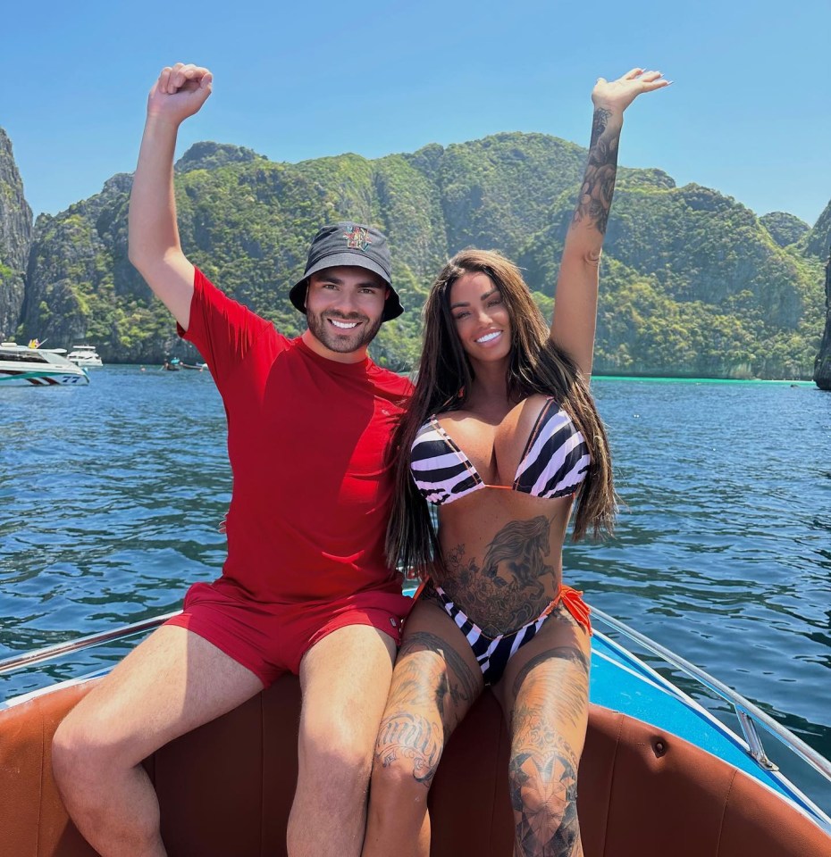 a man and a woman are sitting on a boat in the water