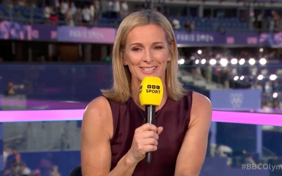 a woman holding a microphone that says bbc sport