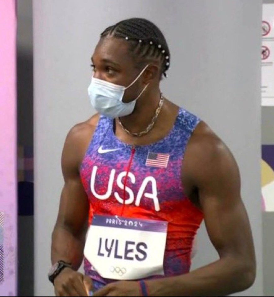 a man wearing a mask and a usa jersey