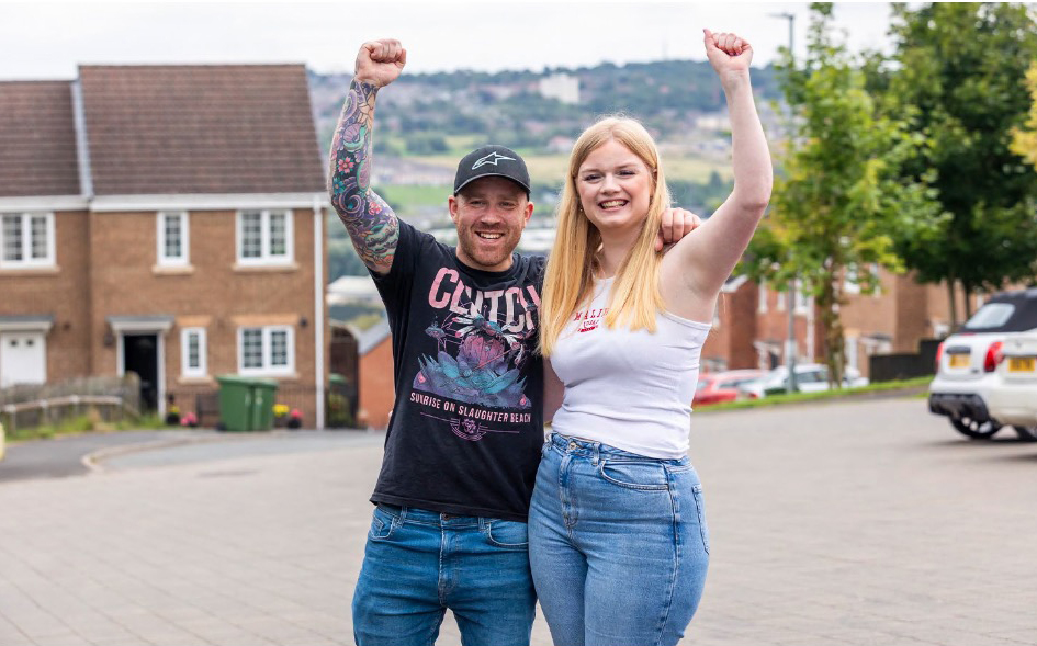 a man wearing a shirt that says clutch stands next to a woman