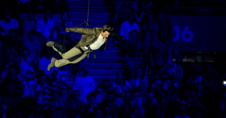 Tom abseiled off the roof of the Stade de France in Paris as part of the handover during the Olympics closing ceremony