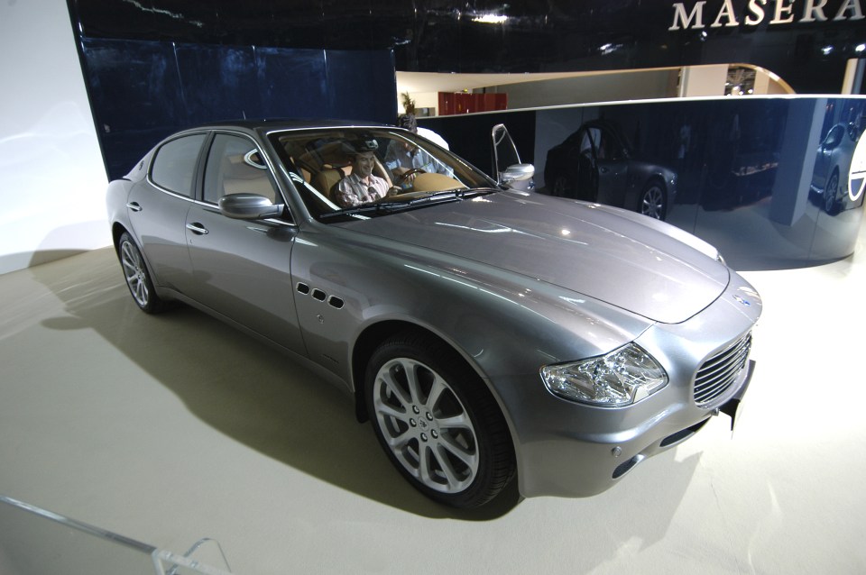 a maserati car is on display at a car show