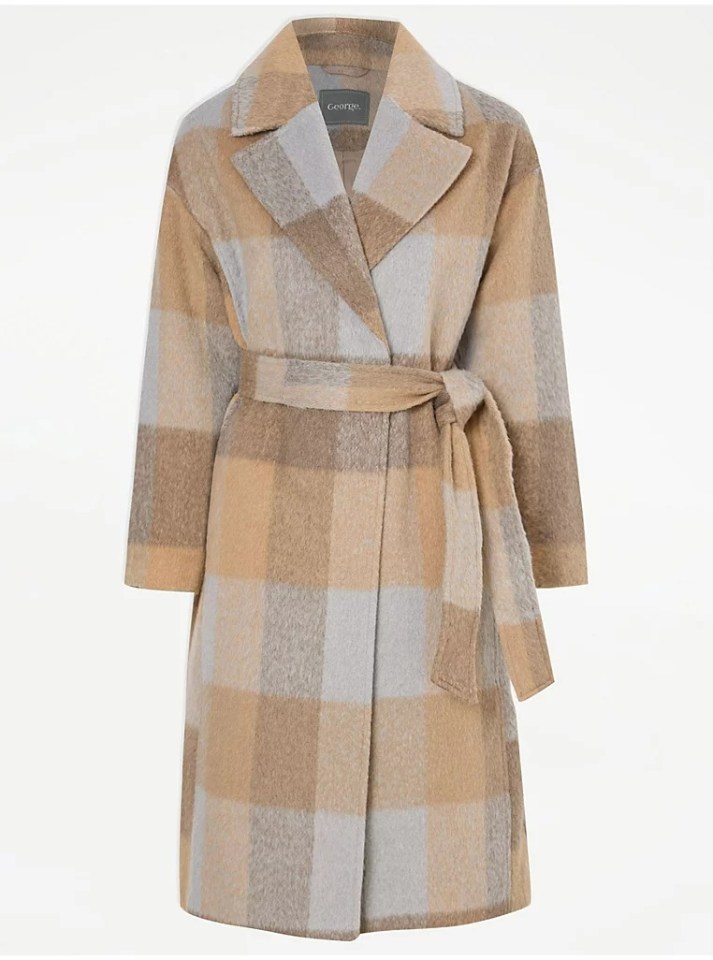 a tan and grey plaid coat with george written on the front