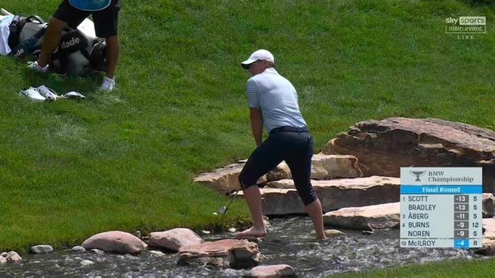 McIlroy then took off his shoes and socks after hitting the ball next to the water