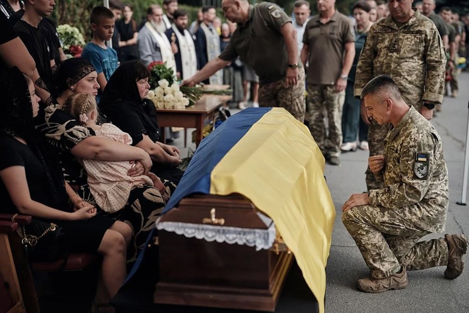 The funeral of Oleksiy where the pilot was buried saw troops pay their respects