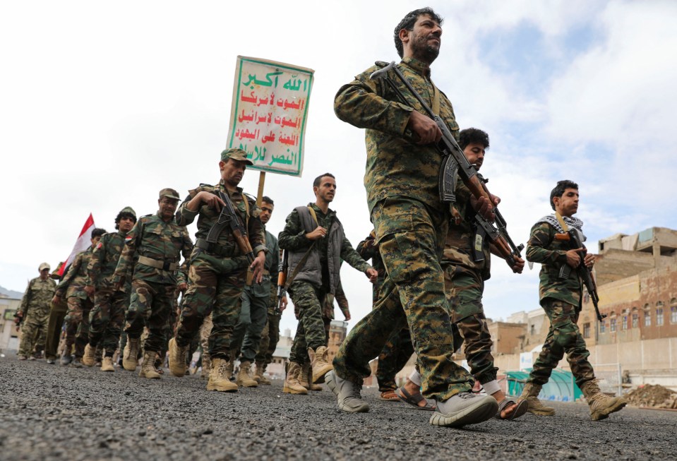 Fighters recruited into the Houthis marched along as part of a mobilisation campaign