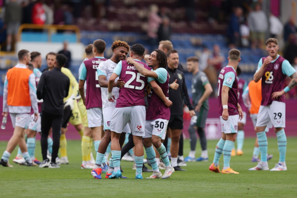 Burnley players celebrate at full time during the Sky Bet Championship match at Turf Moor, Burnley. Picture date: Saturday August 17, 2024. PA Photo. See PA story SOCCER Burnley. Photo credit should read: Gary Oakley/PA Wire. RESTRICTIONS: EDITORIAL USE ONLY No use with unauthorised audio, video, data, fixture lists, club/league logos or "live" services. Online in-match use limited to 120 images, no video emulation. No use in betting, games or single club/league/player publications.