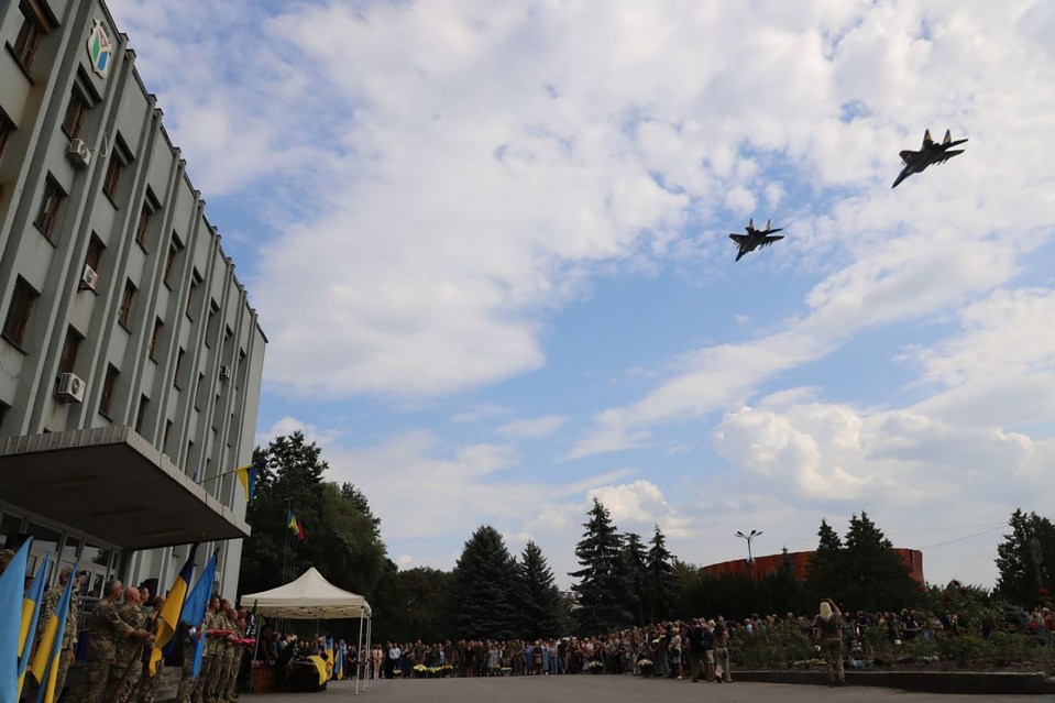 A pair of MiG-29 fighters paid their respects from the sky at the funeral