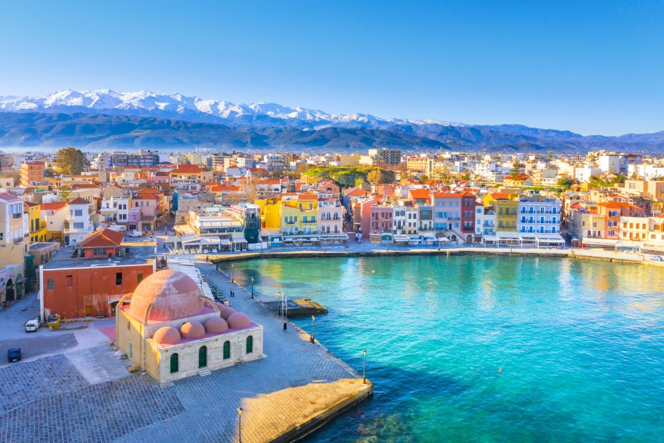 The bustling city of Chania is lined by emerald blue water