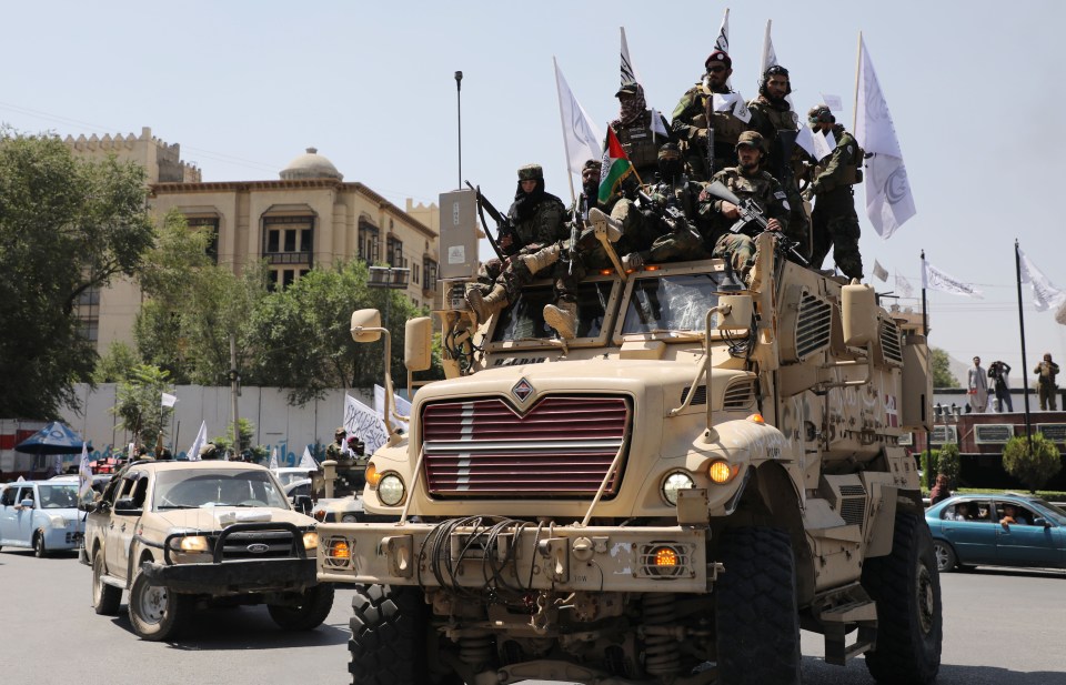 Taliban troops celebrate three years in power in front of former US Embassy in Kabul