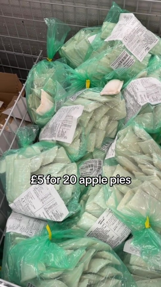 bags of apple pies are stacked on top of each other